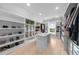 Spacious walk-in closet with custom shelving and hardwood floors at 2400 Worth Ave, Loganville, GA 30052
