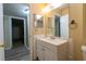Classic bathroom featuring a vanity and ample mirror space, with a view to additional rooms at 2986 Parc Lorraine, Lithonia, GA 30038