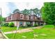 Charming multi-Gathering home with lush green lawn and manicured landscaping and inviting curb appeal at 2986 Parc Lorraine, Lithonia, GA 30038