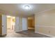 Open-concept living room showcasing new floors and a view into the adjacent kitchen area at 2986 Parc Lorraine, Lithonia, GA 30038