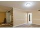 Bright living room with updated flooring, neutral walls, and a mirrored fireplace accent at 2986 Parc Lorraine, Lithonia, GA 30038