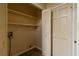 Utility room with storage shelves and washer and dryer hookups, offering practical space at 2986 Parc Lorraine, Lithonia, GA 30038