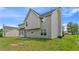 A view of the home's backyard, showing a flat grassy area and rear exterior at 331 Overlook Turn Nw, Conyers, GA 30012
