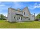 Large, grassy backyard with a gray sided two story home at 331 Overlook Turn Nw, Conyers, GA 30012