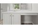 Bathroom vanity features a sink and a makeup area with bright natural light at 331 Overlook Turn Nw, Conyers, GA 30012