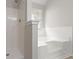 Bright bathroom with a combined shower and tub and a window for natural light at 331 Overlook Turn Nw, Conyers, GA 30012