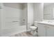 Bathroom with combined tub and shower, white toilet, and vanity at 331 Overlook Turn Nw, Conyers, GA 30012