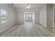 Spacious bedroom with gray wood floors, neutral walls, and large double-pane windows at 331 Overlook Turn Nw, Conyers, GA 30012