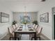 Elegant dining room with stylish furniture and a modern chandelier at 331 Overlook Turn Nw, Conyers, GA 30012