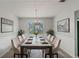 Bright dining room featuring neutral colors, a marble dining table, and modern lighting at 331 Overlook Turn Nw, Conyers, GA 30012
