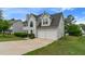 Two-story home with a two car garage, well-manicured lawn and fresh landscaping at 331 Overlook Turn Nw, Conyers, GA 30012