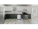 Modern kitchen featuring stainless steel appliances, granite counters, and white cabinets at 331 Overlook Turn Nw, Conyers, GA 30012