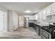 Spacious kitchen featuring stainless steel appliances, granite counters, and hardwood floors at 331 Overlook Turn Nw, Conyers, GA 30012