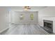 Bright living room features hardwood floors, a fireplace, and lots of natural light at 331 Overlook Turn Nw, Conyers, GA 30012