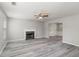 Cozy living room with a fireplace and an open view of the dining area at 331 Overlook Turn Nw, Conyers, GA 30012