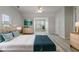Spacious main bedroom features plenty of natural light, a ceiling fan, and hardwood floors at 331 Overlook Turn Nw, Conyers, GA 30012