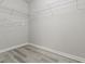Walk-in closet featuring wire shelving and modern flooring at 331 Overlook Turn Nw, Conyers, GA 30012