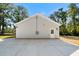 A house exterior view from the backyard, featuring a door and ample parking space at 389 Campground School Rd, Dallas, GA 30157