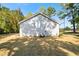 House exterior and backyard view showing the siding, air conditioning unit, and lawn at 389 Campground School Rd, Dallas, GA 30157