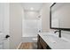 Bathroom with tub-shower combination, modern vanity, stylish faucet and wood look floors at 389 Campground School Rd, Dallas, GA 30157