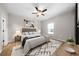 Stylishly decorated bedroom with a ceiling fan and bright window, complemented by modern decor at 389 Campground School Rd, Dallas, GA 30157