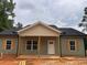 Charming single-story home with wooden shutters, front porch, and freshly installed siding at 389 Campground School Rd, Dallas, GA 30157