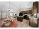 Bright open layout featuring an eat-in kitchen with granite countertops, stainless appliances, and an adjacent dining area at 389 Campground School Rd, Dallas, GA 30157