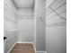 Spacious walk-in closet featuring wire shelving and durable laminate flooring offering organized storage at 389 Campground School Rd, Dallas, GA 30157
