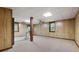 Spacious basement with paneled walls, carpet, and drop ceiling at 2101 Breconridge Sw Dr, Marietta, GA 30064