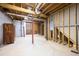Unfinished basement featuring concrete floor, exposed beams, and wood framing at 2101 Breconridge Sw Dr, Marietta, GA 30064