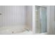 Bathroom featuring soaking tub and shower with sliding glass door at 2101 Breconridge Sw Dr, Marietta, GA 30064