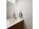 Cozy bathroom with classic wallpaper, wood vanity and gold fixtures at 2101 Breconridge Sw Dr, Marietta, GA 30064