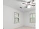 Bedroom with neutral walls, ceiling fan, and windows with shutters at 2101 Breconridge Sw Dr, Marietta, GA 30064