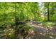 A small creek meanders along the property's edge at 2101 Breconridge Sw Dr, Marietta, GA 30064
