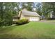 Exterior of home featuring an attached garage and well-manicured lawn at 2101 Breconridge Sw Dr, Marietta, GA 30064