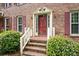 Charming front entryway with a classic door and brick steps, surrounded by lush greenery at 2101 Breconridge Sw Dr, Marietta, GA 30064