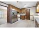 Efficient kitchen with stainless steel refrigerator and access to the adjacent dining room at 2101 Breconridge Sw Dr, Marietta, GA 30064