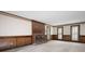 Spacious living room with a brick fireplace and paneled walls at 2101 Breconridge Sw Dr, Marietta, GA 30064