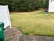 Fenced backyard showing the expansive lawn and partial view of the home's exterior at 2653 Parkway Trl, Lithonia, GA 30058