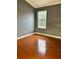Bedroom featuring hardwood floors and a window at 2653 Parkway Trl, Lithonia, GA 30058