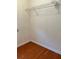 Walk-in closet with one wire shelf and hardwood flooring at 2653 Parkway Trl, Lithonia, GA 30058