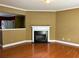 Living room includes a decorative fireplace, hardwood floors, and an open concept at 2653 Parkway Trl, Lithonia, GA 30058
