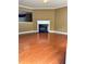 Spacious living room featuring a fireplace, hardwood floors, and neutral wall color at 2653 Parkway Trl, Lithonia, GA 30058