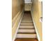 An interior view showcases wooden stairs with white trim leading to the second floor at 2653 Parkway Trl, Lithonia, GA 30058