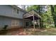 View of the deck, sliding doors, and back exterior of the house at 345 Deerwood Dr, Suwanee, GA 30024