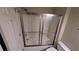 Bathroom featuring a shower with glass doors at 345 Deerwood Dr, Suwanee, GA 30024