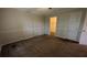 Bedroom features a ceiling fan, carpeted flooring, and closet at 345 Deerwood Dr, Suwanee, GA 30024