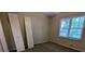 Bedroom with carpet, natural light, and neutral decor at 345 Deerwood Dr, Suwanee, GA 30024