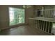 Dining room featuring wood flooring, large windows and chandelier at 345 Deerwood Dr, Suwanee, GA 30024