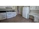 Bright eat-in kitchen featuring appliances, work space, and tile countertops at 345 Deerwood Dr, Suwanee, GA 30024